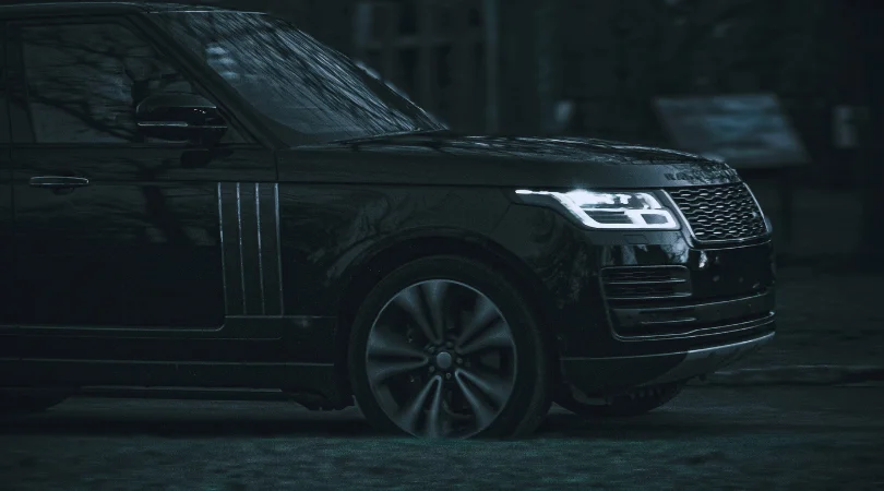Black Range Rover parked at night, one of the UK’s most frequently stolen vehicles.