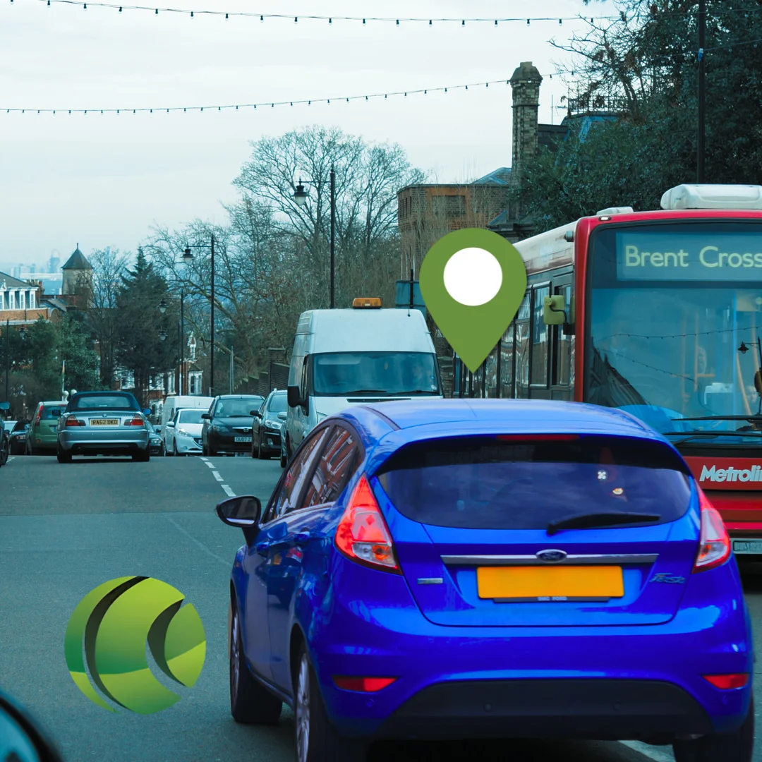 Blue car on busy London road with GPS tracking